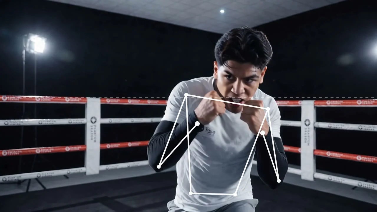 Pose skeleton tracked on a fighter in the ring, hands at the chin