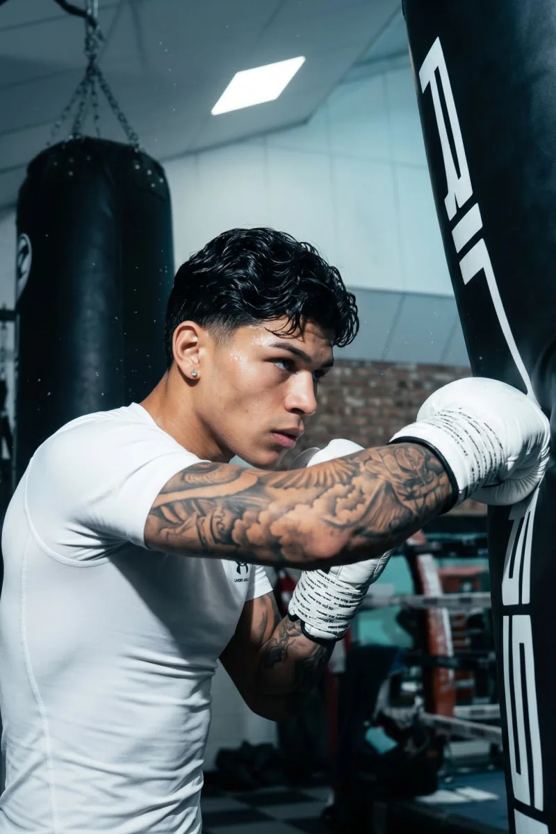 A fighter by a heavy bag